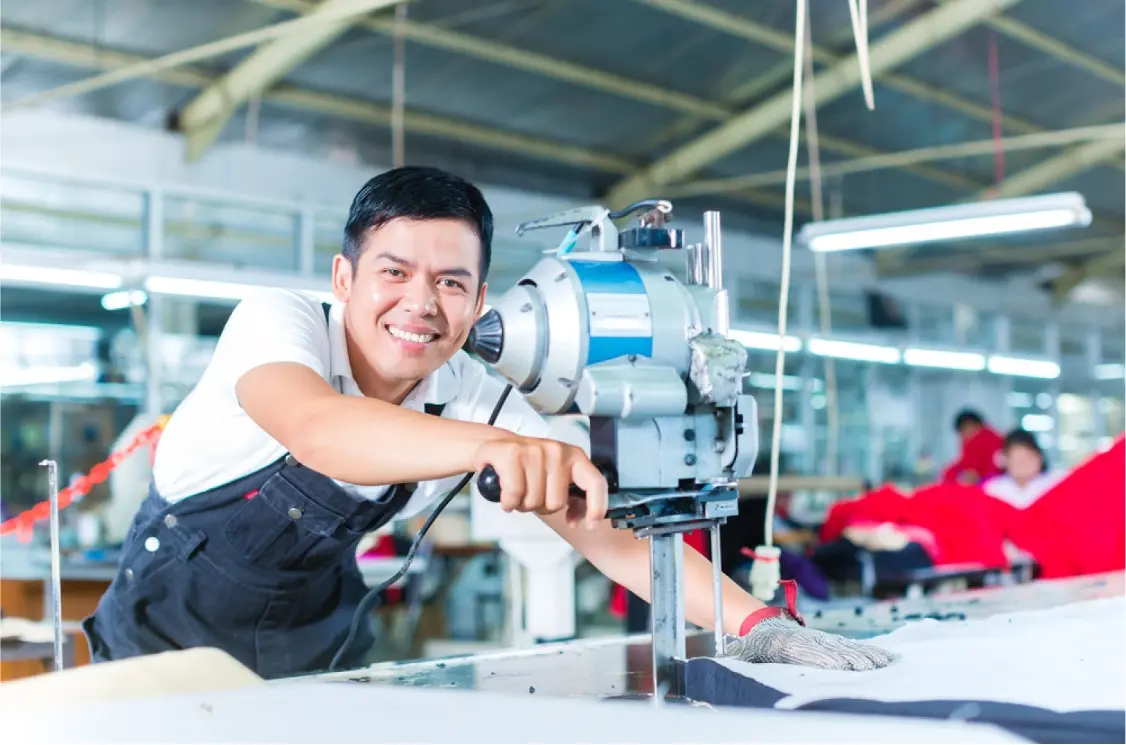 stock-photo-indonesian-worker-using-a-cutter-a-large-machine-for-cutting-fabrics-in-a-asian-textile-factory-155647982-transformed