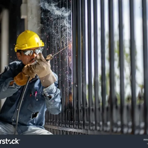 stock-photo-asian-welders-in-welding-and-grinding-as-sparks-flew-out-of-the-iron-grate-and-wear-a-helmet-and-2213154815-transformed