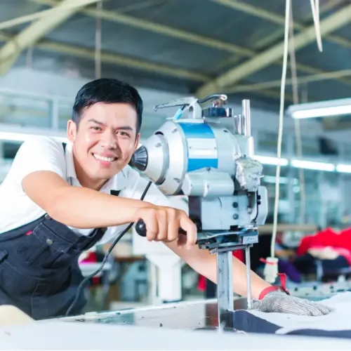 stock-photo-indonesian-worker-using-a-cutter-a-large-machine-for-cutting-fabrics-in-a-asian-textile-factory-155647982-transformed