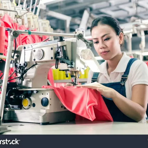 stock-photo-seamstress-or-worker-in-asian-textile-factory-sewing-with-industrial-sewing-machine-556507657-transformed