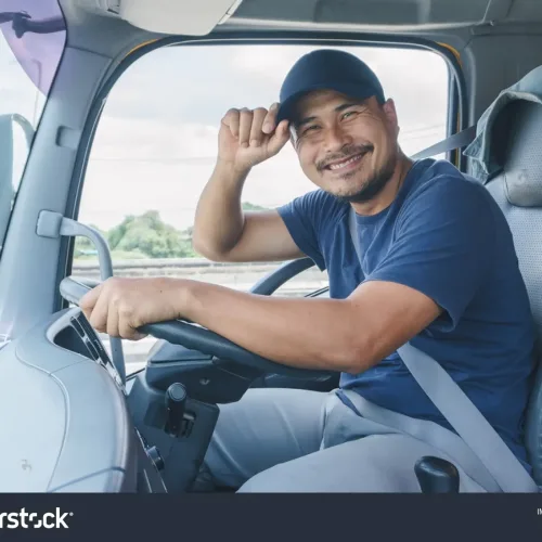 stock-photo-smile-confidence-young-man-professional-truck-driver-in-business-long-transport-1801689064-transformed