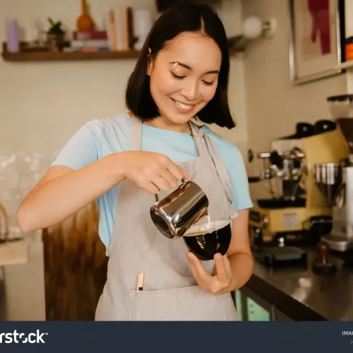 stock-photo-young-asian-barista-woman-wearing-apron-smiling-while-making-coffee-in-cafe-2150556923-transformed